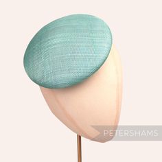 Our most popular shape, now available in loads of awesome colours! This aqua round button fascinator hat base is made from 2 layers of super stiff sinamay straw and is an ideal size for making fascinators. Each base is lined with sinamay bias on it's inside edge and is ready for you to decorate! Can be attached to the head with elastic, hair comb or headband (not included). Measurements: Width: 17cm (6.6 inches) Height: 4.5cm (1.7 inches) Over 100 different hat bases are available! To see them a Making Fascinators, Elastic Hair Comb, How To Make Fascinators, Sinamay Fabric, Blank Hats, Millinery Supplies, Hat Base, Different Hats, Velvet Flowers