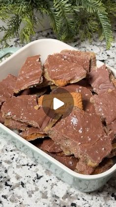 a bowl filled with brownies sitting on top of a counter