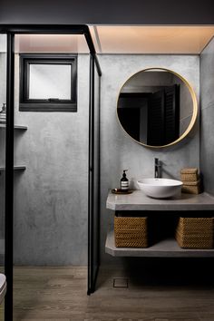 a bathroom with a sink, mirror and shelves on the wall next to each other