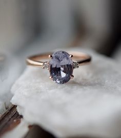 a close up of a ring with a stone on it