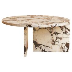 an oval marble table with two legs and a circular top, on a white background