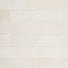 a white brick wall with no mortars on it