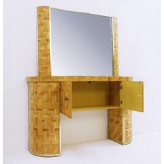 a wooden vanity with mirror and cupboards on it's sides, against a white wall