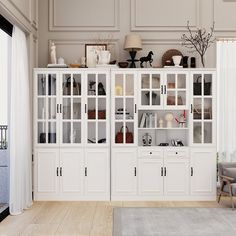 a living room filled with furniture and lots of white cupboards on top of each other