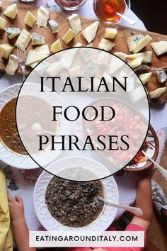 top view of table with white table cloth with various bowls of tomatoes, stews and beans with a cheese board and honey in small glass bowls. A small boy is reaching over the side the of the table Italian Food Names, Italian Phrases For Travelers, Best Italian Food, Dinner Italian, Italian Holiday, Hand Gestures