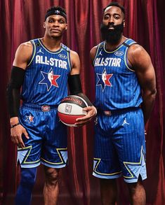 two basketball players pose for a photo in front of a red curtain with the name all - star written on it