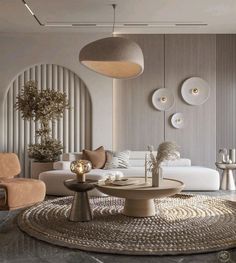 a living room filled with white furniture and lots of pillows on top of a rug