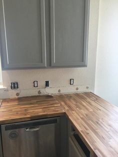 the kitchen counter is made out of wood