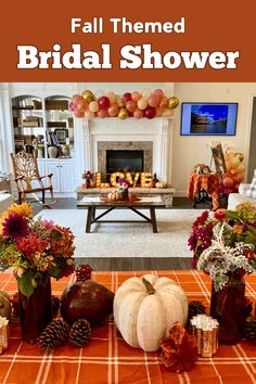 fall themed bridal shower with pumpkins, flowers and decorations on an orange table cloth