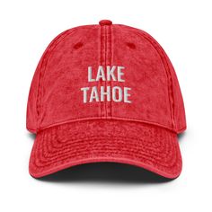 Gear up for your next adventure with the Lake Tahoe Hat! This unisex cap features a vintage wash and embroidered design, adding a touch of denim inspired style to your look. With an adjustable strap, it's a perfect fit for all your travels - whether you're hitting the lake or exploring new destinations. The details: Low profile dad hat 100% superior cotton twill 6-panel unstructured, soft crown 6 sewn eyelets Black sweatband Metal snap buckle with an antique brass finish Washed-out vintage effec George Hats, Lake Lanier, Dauphin Island, Lake Oconee, Lake Champlain, Big Bear Lake, Lake Powell, Lake George, Denim Style