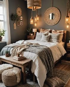 a large bed sitting in a bedroom on top of a wooden floor next to a window