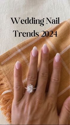 a woman's hand with a diamond ring on it and the words wedding nail trend 2014