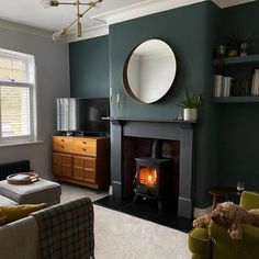 a living room filled with furniture and a fire place