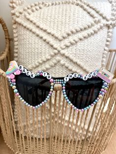 These sunglasses are unique, stylish and just the perfect accessory for the ultimate 80's party.  If you would like a different version of beading or have another idea in mind just message me. I can do whatever you would like.  Return Policy: As these sunglasses are customized products, we do not accept returns or exchanges unless there is a misspelling, we will send a corrected item at no additional charge. Retro Plastic Festival Sunglasses, Trendy Summer Sunglasses For Birthday, Retro Plastic Sunglasses For Party, Retro Plastic Sunglasses For Parties, Festival Fun Sunglasses With Mirrored Lenses, Trendy Plastic Sunglasses For Music Festival, Trendy Plastic Sunglasses For Festivals, Fun Spring Festival Sunglasses, Retro Sunglasses With Uv Protection For Parties