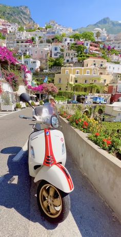 a motor scooter parked on the side of a road