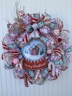 a christmas wreath hanging on the side of a wall