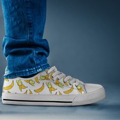 Our yellow banana shoes are sure to attrack some attention ! Our custom made shoes are sure to attrack some attention! All of our sneakers are custom-made-to-order and handcrafted to the highest quality standards Check out more of our footwear here: https://www.etsy.com/shop/unicornshoesshop/ Product Name: Yellow Banana Shoes | Banana Sneakers | Cute Shoes | Casual Shoes | Banana Clothing | Low Top Converse Style Shoes for Womens Mens Adults Product Features; ▶ Full canvas double sided print wit Yellow Casual Skate Shoes, Banana Shoes, Dinosaur Shoes, Batman Gifts, Sneakers Cute, Yellow Banana, High Tops Sneakers, Low Top Converse, Tie Sneakers