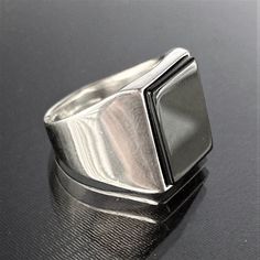 Silver Black Square Onyx Ring , Silver Onyx Stone Ring , Natural Black Stone Ring , 925k Silver Handmade Ring , Gift For Him , Same Day Free Fast Shipping ✓ PRODUCT FEATURES : ✧ Handmade Item ✧ Materials: 925 Sterling Silver ✧ We send it together with a Cebeci Silver gift box, a silver cleaning cloth and a surprise gift. ✧ Ring Weight : 13 Gram  ✓USAGE DETAILS : * Silver jewelry is very sensitive to chemicals. It is recommended to keep away from chemical substances such as cream, bleach, deodorant, detergent. * Silver jewelry can also darken quickly in salt water, that is, in sea water. For this reason, it is best to remove them when swimming in the sea. ✓ SHIPPING : * Your orders placed on weekdays are delivered to the cargo on the same day. Your orders placed on the weekend are delivered Black Ring With Polished Edges, Black Rings With Polished Edges For Gifts, Modern Silver Signet Ring With Black Enamel, Modern Black Signet Ring With Polished Edges, Formal Silver Signet Ring With Black Enamel, Modernist Black Signet Ring With Polished Finish, Silver Minimalist Rings With Black Enamel, Minimalist Silver Rings With Black Enamel, Hallmarked Black Rectangular Rings