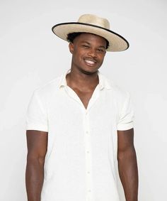 100% Palmilla Straw Authentic Feather Trim Bound Brim Edge Brim Size: 4" One Size Fits Most Resort Style Embrace timeless sophistication with the Peter Grimm Tarot Wide Brim Mexican Palm Straw Fedora Hat. Crafted from 100% Palmilla Straw, this hat exudes both durability and elegance. Its flat brim, measuring at a generous 4 inches, adds a sleek and distinctive touch to your ensemble. The hat features a refined grosgrain band and a leather overlay, embellished with an authentic feather trim, elevating its aesthetic appeal. A black bound brim edge further enhances its polished look. Not just a fashion statement, this hat also prioritizes functionality, offering UPF50+ sun protection, making it a reliable companion for sunny days. With its one-size-fits-most design, it ensures a comfortable a White Fitted Toquilla Straw Sun Hat, Fitted White Toquilla Straw Sun Hat, Fitted White Panama Hat For Summer, White Fitted Panama Hat For Beach, Fitted White Panama Hat For Beach, Fitted Cream Panama Hat For Beach, Cream Fitted Fedora For The Beach, Fitted Cream Fedora For Beach, Fitted Cream Fedora For The Beach