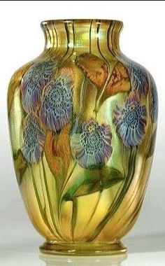 a glass vase with flowers painted on it