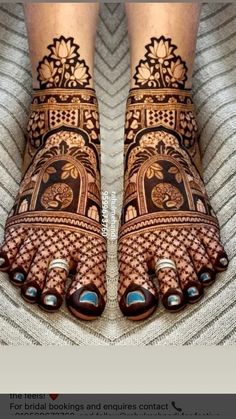 the legs and feet of a woman with henna tattoos