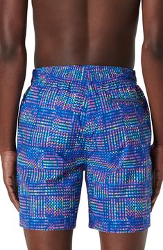 Bright and bold, these printed swim trunks made of lightweight, quick-drying fabric sport a roomy fit and plenty of pockets for essentials. Elastic/drawstring waist Side-seam pockets; back zip pocket with drainage grommets Mesh liner 100% polyester Machine wash, dry flat Imported Athleisure Swim Trunks With Pockets For Beach, Blue Sports Swimwear With Functional Drawstring, Blue Swim Trunks With Side Pockets, Sports Blue Printed Swimwear, Blue Swim Trunks With Elastic Waistband For Poolside, Blue Nylon Swim Trunks For Sports, Casual Blue Swim Trunks With Side Pockets, Blue Vacation Shorts With Side Pockets, Blue Nylon Swimming Shorts