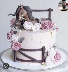 there is a cake decorated with flowers and a horse