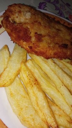 fried fish and fries on a white plate