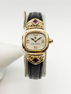 Item Description: VERY Rare David Yurman 18k Yellow Gold Watch...purcahsed in Hong Kong and in solid 18k yellow gold. ALL ORIGINAL with 1ct in Natural SQUARE CUT Burma RUBY. Very cool and rare find. 18k Yellow gold buckle...Retail $10,000. HEAVY high grade watch. WOW!!! Circa 2000...One very rare watch. Band is aftermarket but the watch is all original. Brand: DAVID YURMAN Movement: QUARTZ Metal: 18k Yellow Gold Gram Weight: 32.8 Powered by SixBit's eCommerce Solution Yellow Gold Rectangular Diamond Watch For Evening, Formal Yellow Gold Diamond Watch With Rectangular Shape, Luxury Hallmarked Diamond Watch For Evening, Luxury Hallmarked Diamond Watch For Evenings, Designer Yellow Gold Watches With Polished Finish, Luxury Hallmarked Evening Watches, Classic Yellow Gold Jewelry For Evening, Elegant Yellow Gold Jewelry For Evening, Luxury Hallmarked Diamond Watch For Anniversary