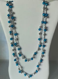 This beautiful necklace has icy blue square transparent beads and silver round beads. Hand crochet. Can be layered and worn in different lengths. Silver Beaded Double Strand Crystal Necklace, Silver Double Strand Beaded Crystal Necklace, Handmade Silver Multi-strand Crystal Necklaces, Silver Wire Wrapped Beaded Necklaces For Party, Crochet Beaded Necklace, Icy Blue, Blue Square, Beautiful Necklace, Hand Crochet