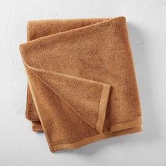 two brown towels folded on top of each other