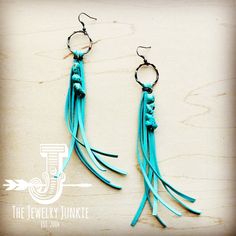 Indulge in the perfect blend of boho and chic vibes with our Leather Fringe Earrings with Turquoise Chunks. These stylish earrings boast a unique fringe design and are adorned with stunning turquoise chunks, making them the perfect statement piece for any outfit. Elevate your look and add a touch of sophistication with these must-have earrings. Approx. Length: 5" from hoop to leather fringe end and Tied with a wax thread Although your item will resemble the photo, each piece is created by hand, Turquoise Dangle Tassel Earrings For Festival, Handmade Turquoise Tassel Earrings, Turquoise Handmade Tassel Earrings For Festivals, Handmade Turquoise Tassel Earrings For Festival, Blue Bohemian Earrings With Fringe, Bohemian Blue Earrings With Fringe, Bohemian Turquoise Earrings For Festival, Turquoise Fringe Tassel Drop Earrings, Turquoise Tassel Drop Earrings