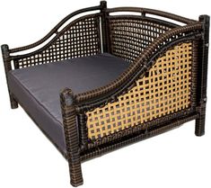 the bed frame is made out of wicker and black leather