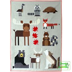 a quilt with animals on it in the woods