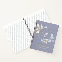 two notebooks with wedding planner pages on the front and back, one is blank