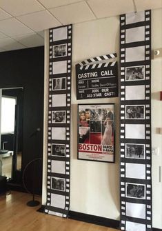 a movie poster is hanging on the wall next to a wooden floor in an office