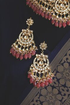 Gold Plated kundan and uncut polki set on a silver and copper alloy base. This necklace set is plated with 22k gold and embellished with semi precious rose quartz stones. Heavy necklace set with chandbaali earrings for bridal dressing.This Sabyasachi inspired necklace with a twist of coloured stones by Paisley Pop is a perfect accessory for an Indian Bride. Kundan Gold Plated Indian Bridal Jewellery with Emerald Green stones and light Pink agate stones, Semi precious Uncut Kundan Polki Indian We Fusion Style Kundan Bridal Earrings For Reception, Festive Fusion Chandbalis With Hand Set Details, Celebration Kundan Hand-set Chandbalis, Fusion Style Hand Set Chandbali Kundan Necklace, Fusion Kundan Bridal Earrings With Cutdana, Fusion Style Kundan Chandbali Necklace, Silver Chandbalis With Cutdana For Reception, Fusion Kundan Necklace With Meenakari For Receptions, Hand Set Kundan Chandbalis For Celebration