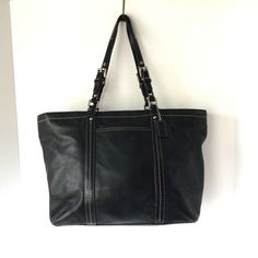 COACH Large East West Black Leatherware Shoulder Tote Bag VGUC. Please Note: There is some cracking on the strap sides. However, they are structurally sound. Classic Satchel With Silver-tone Hardware For Errands, Black Travel Bags With Branded Hardware, Coach Leather Bag With Silver-tone Hardware, Black Leather Bag With Silver-tone Hardware, Classic Black Bag For Errands, Black Satchel With Branded Hardware For Travel, Black Travel Satchel With Branded Hardware, Black Leather Bags With Branded Hardware, Classic Shoulder Bag With Branded Hardware For Errands