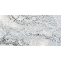 a white marble counter top with grey veining on the edges and an abstract design