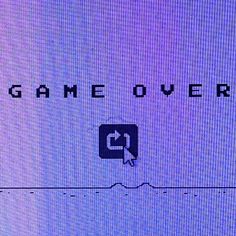 the game over logo is displayed on a screen in front of an image of a mouse