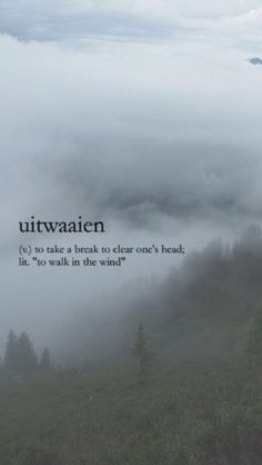 a foggy mountain with the words uttwatien on it