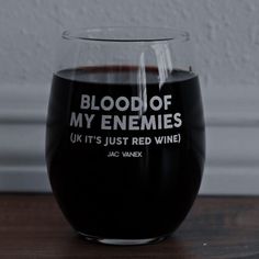 a wine glass with blood of my enemies written on it