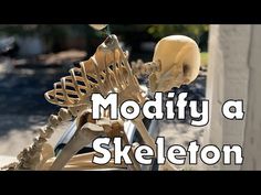 a skeleton sitting on top of a wooden bench next to a building with the words modify a skeleton above it