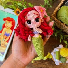 the little mermaid doll is crocheted in red and green