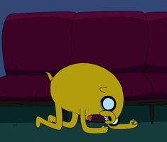 a cartoon character is sitting on the floor in front of a couch with its eyes open