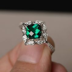 This is a gorgeous handmade creation. Its beauty is its simplicity & Elegance. The 7*7 mm cushion shape faceted lab emerald is crafted in solid sterling silver and with rhodium plated. All item is sent in a beautiful gift box If you have any idea of design your ring,pls contact me directly. You can realize more lovely stuff clicking the link https://www.etsy.com/shop/knightjewelry?refshopsection_shophome_leftnav Please leave the correct address and you phone number for delivering successfull Wedding Rings With May Birthstone In Square Cut, Square Cut Emerald Ring With Accent Stones For Wedding, Square Cut May Birthstone Wedding Rings, Square Cut Emerald Diamond Ring For Anniversary, Asscher Cut Emerald Ring With Halo Setting For Promise, Silver Emerald Jewelry With Square Cut, Silver Emerald Square Cut Jewelry, Silver Square Cut Emerald Jewelry, Silver Square Cut Emerald Ring