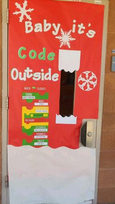 a door decorated with an advertisement for baby it's code outside and snowflakes