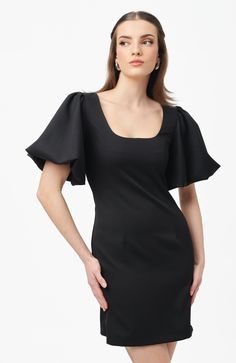 A crisp and feminine mini dress with playful voluminous puff sleeves. Meet Gigi, a dress for making an entrance & to leave a lasting impression. 96% PL 4% EL puff sleeved mini dress zip on the back Elegant Puff Sleeve Mini Dress With Structured Shoulders, Elegant Mini Dress With Puff Sleeves And Structured Shoulders, Elegant Puff Sleeve Mini Dress For Formal Occasions, Black Puff Sleeve Mini Dress For Evening, Party Mini Dress With Puff Sleeves And Structured Shoulders, Party Mini Dress With Structured Puff Shoulders, Chic Evening Puff Sleeve Dress With Draped Sleeves, Formal Fitted Mini Dress With Elastic Sleeves, Elegant Voluminous Puff Sleeve Dress For Party