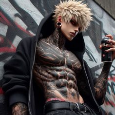 a man with tattoos and piercings holding a camera