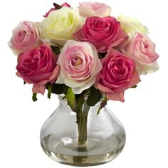 a clear vase filled with pink and white roses